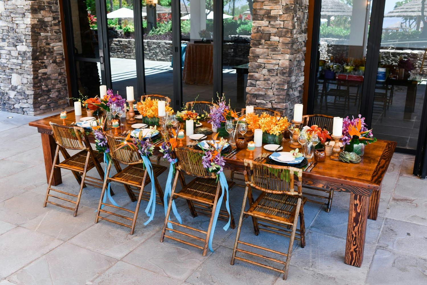 Rustic Beach Tablescape With Pops of Orange, Purple, and Blue | PartySlate