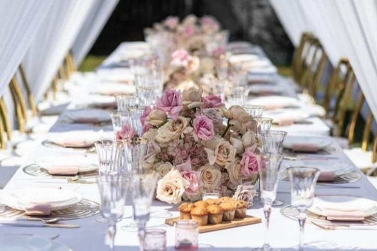 Wedding Tablescape With White Linen and Pink Florals | PartySlate