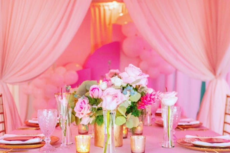 Pink Wedding With Pink Drapery and Centerpieces | PartySlate