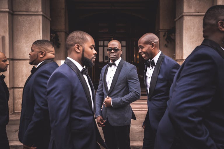 Grooms Men in Blue Suits and Black Sunglasses | PartySlate