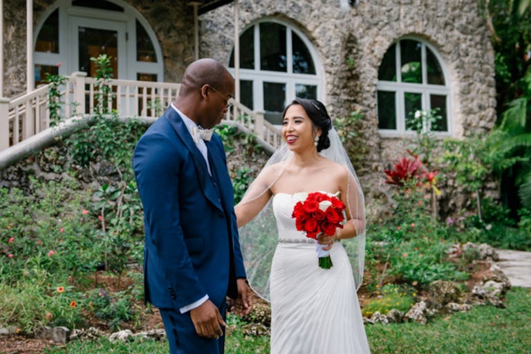 Bride and Groom's First Look at Coconut Grove Events' Lush Garden | PartySlate