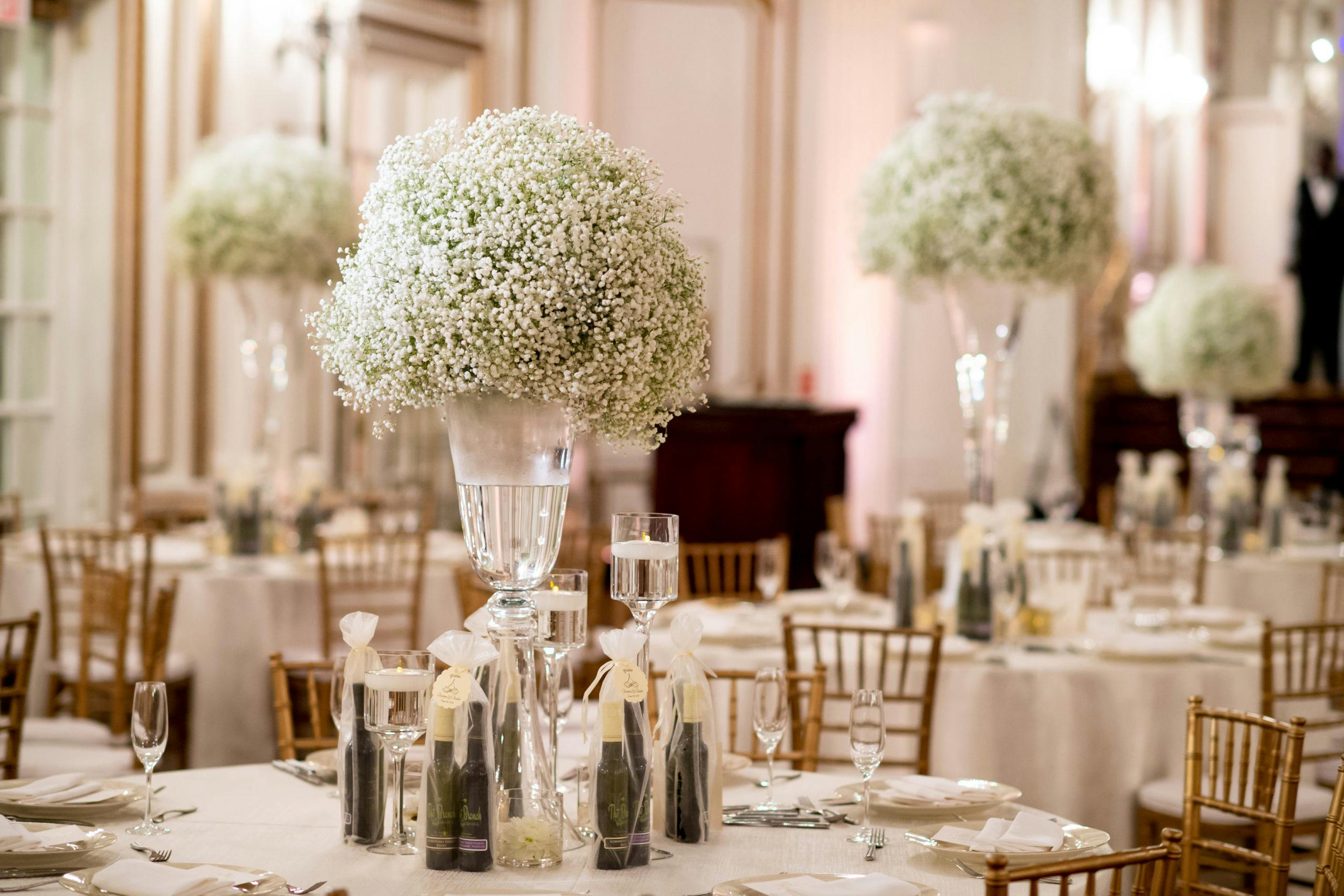Bouquets of Baby’s Breath Wedding Centerpieces At Varying Heights | PartySlate