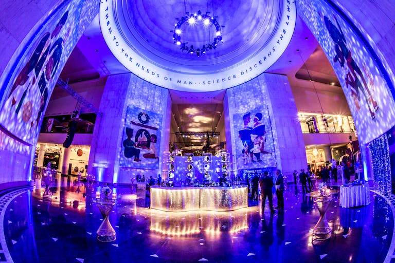 New Year’s Eve Holiday Party With Soft Blue Uplighting at Museum Science and Industry, Chicago | PartySlate