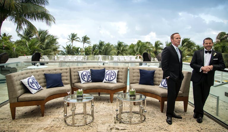 Grooms Pose at Lounge Area at Royal Palm South Beach With Ocean Views | PartySlate