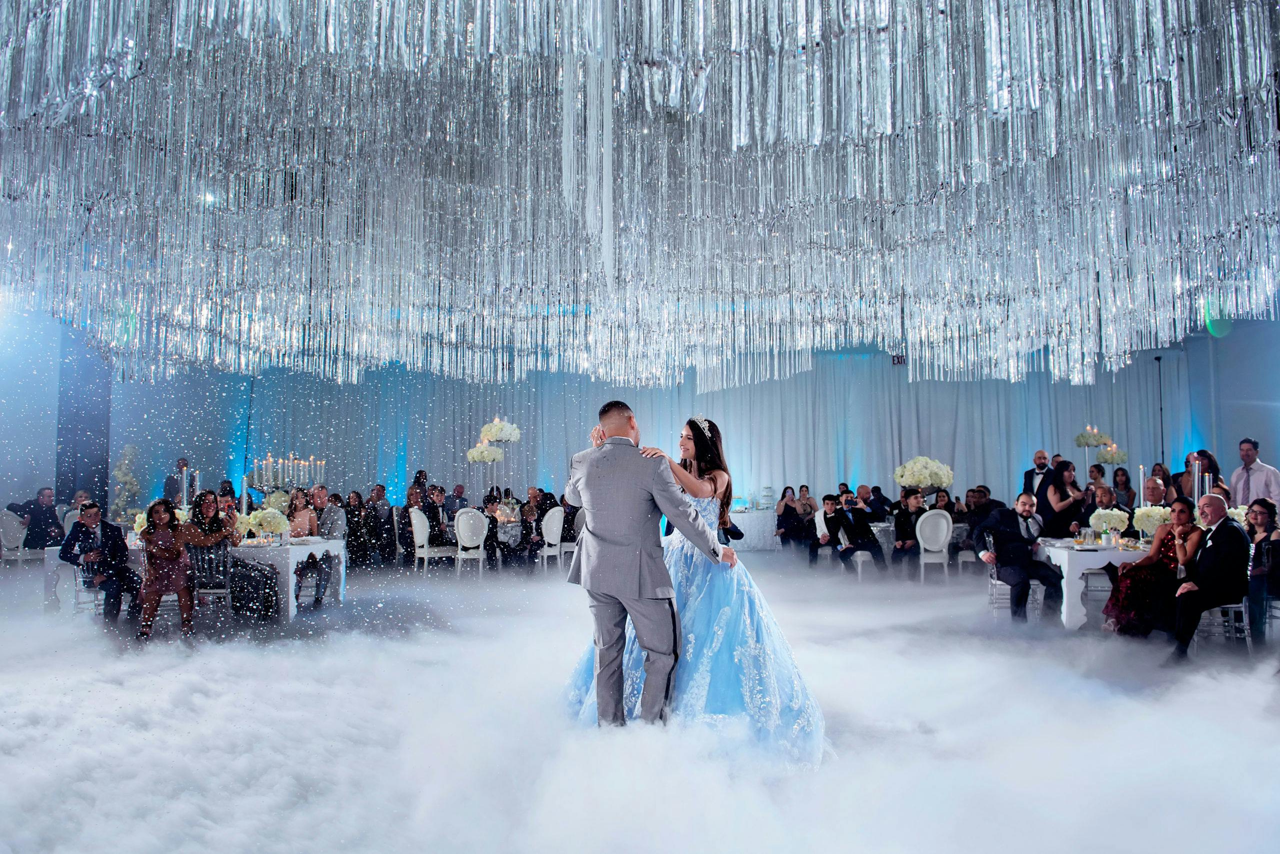 Father and Daughter Dance Through Fog Underneath Crystal Ceiling Installation at Winter Wonderland-Themed Quinceañera | PartySlate