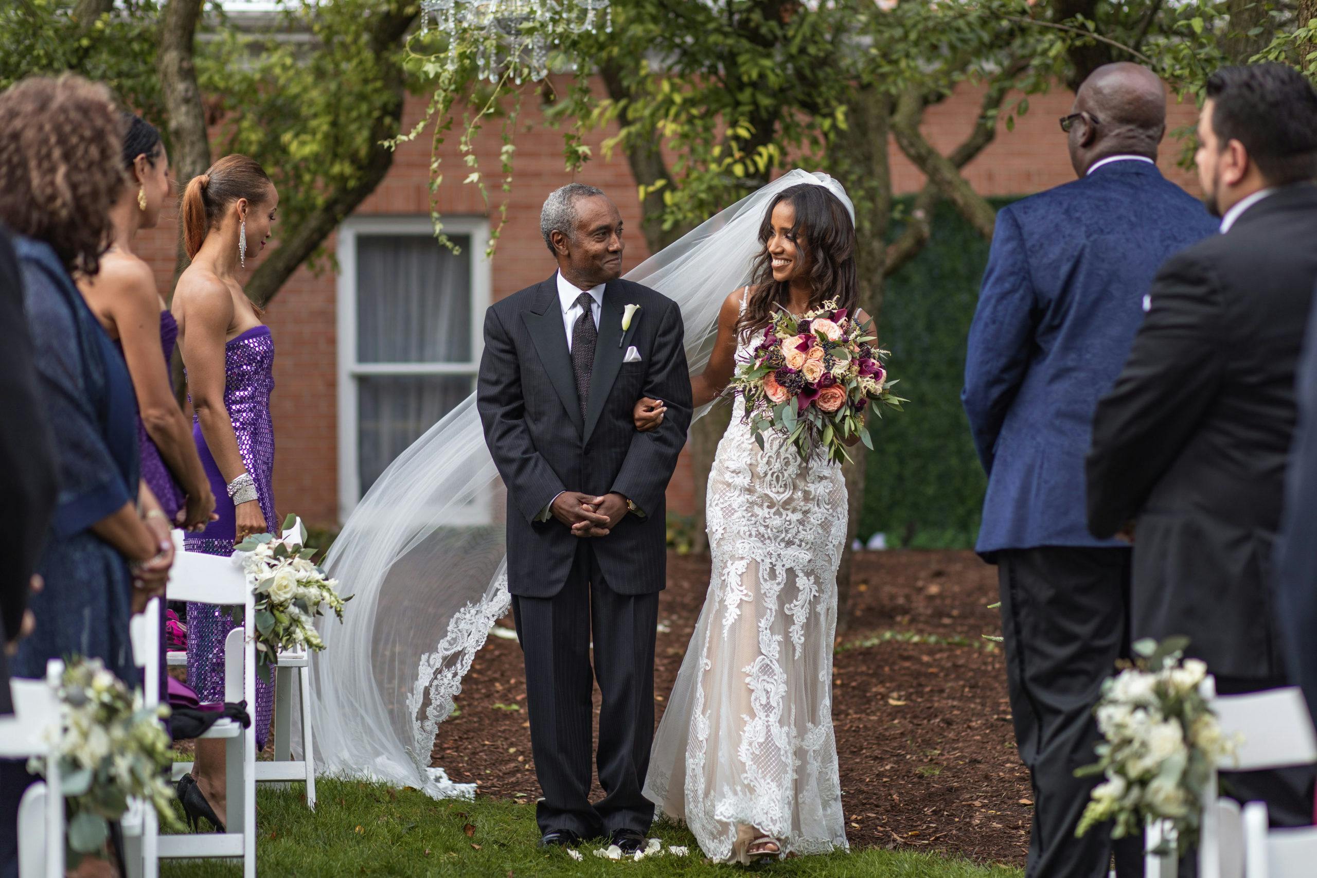Dad and bride walking down aisle | PartySlate
