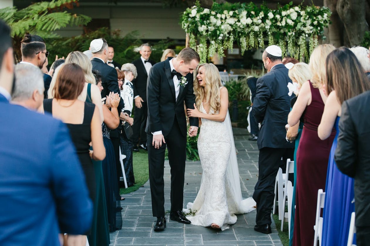Wedding Recessional at Fairmont Miramar Hotel & Bungalows in Santa Monica, CA — an outdoor wedding venue in Los Angeles | PartySlate