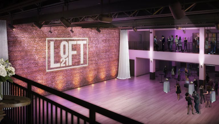 Indoor event venue space with purple uplighting at Loft 21 in Lincolnshire, IL | PartySlate