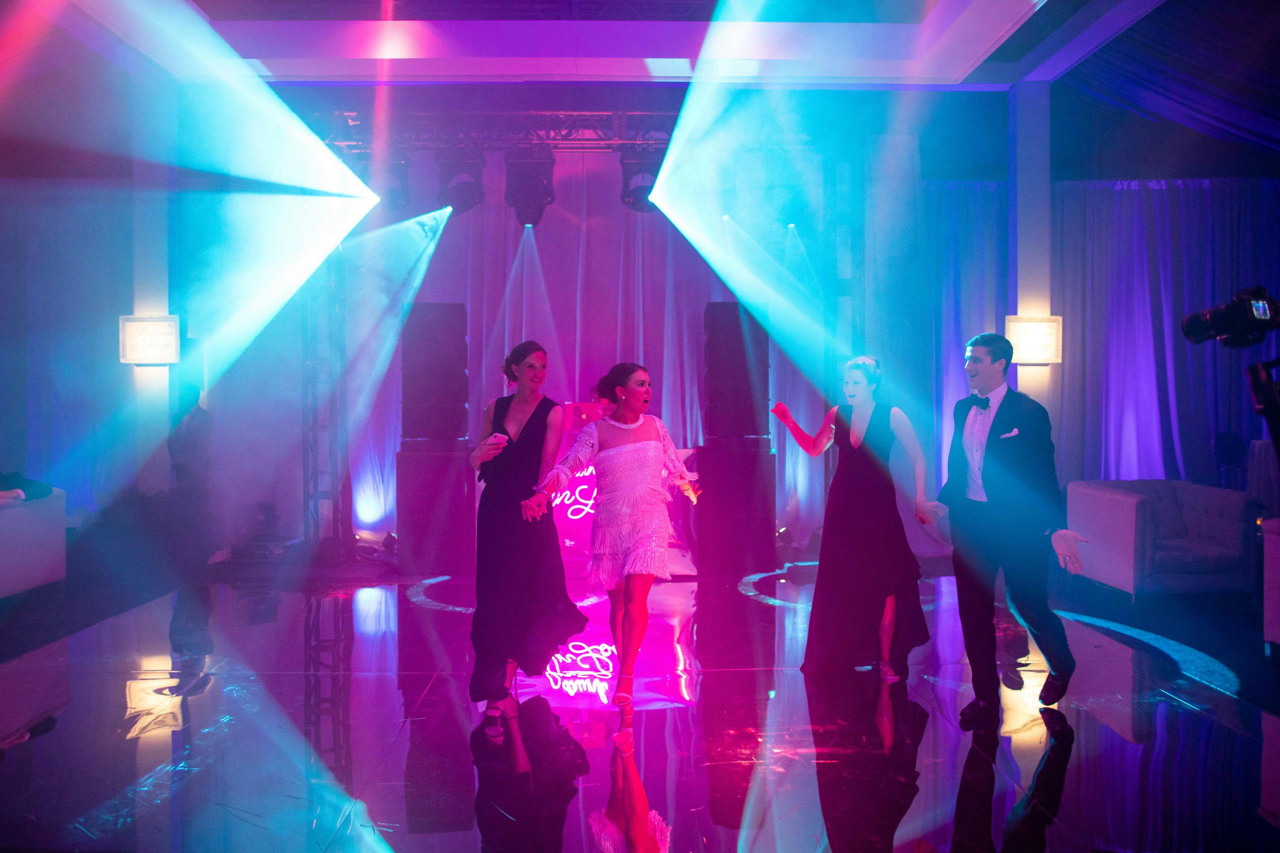 dramatic blue and purple neon lighting at wedding after-party | PartySlate