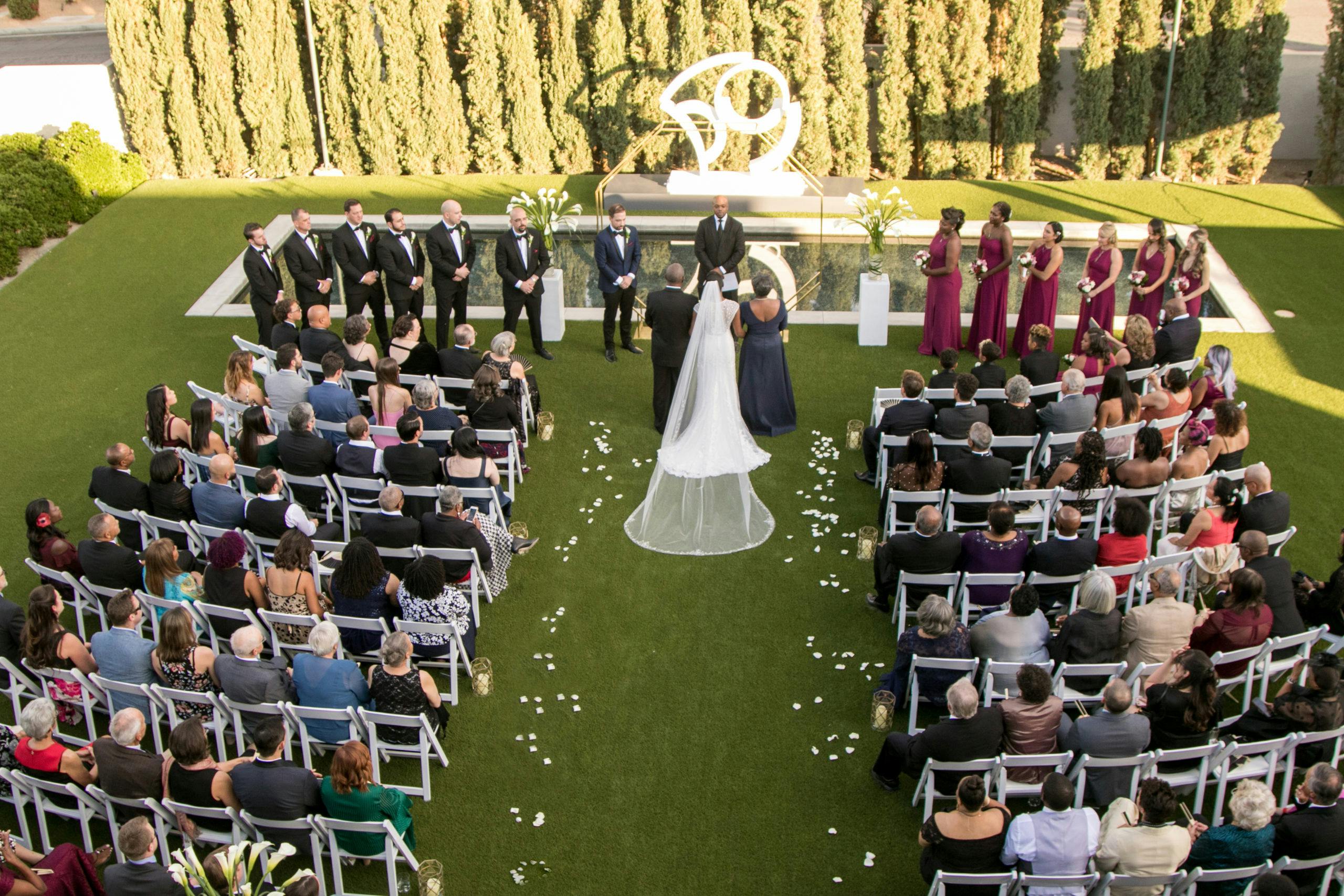 An aerial view of outdoor wedding ceremony | PartySlate