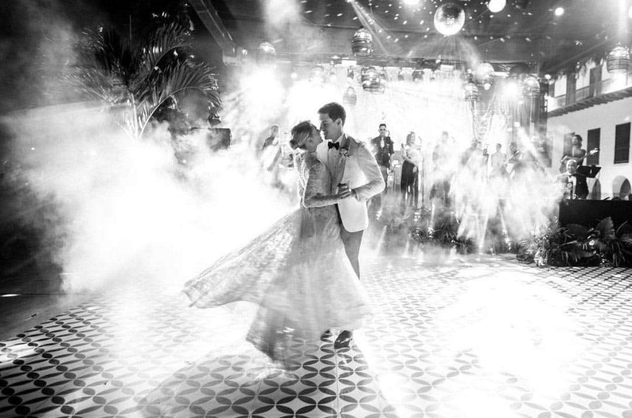 Black and white photo of bride and groom’s first dance | PartySlate