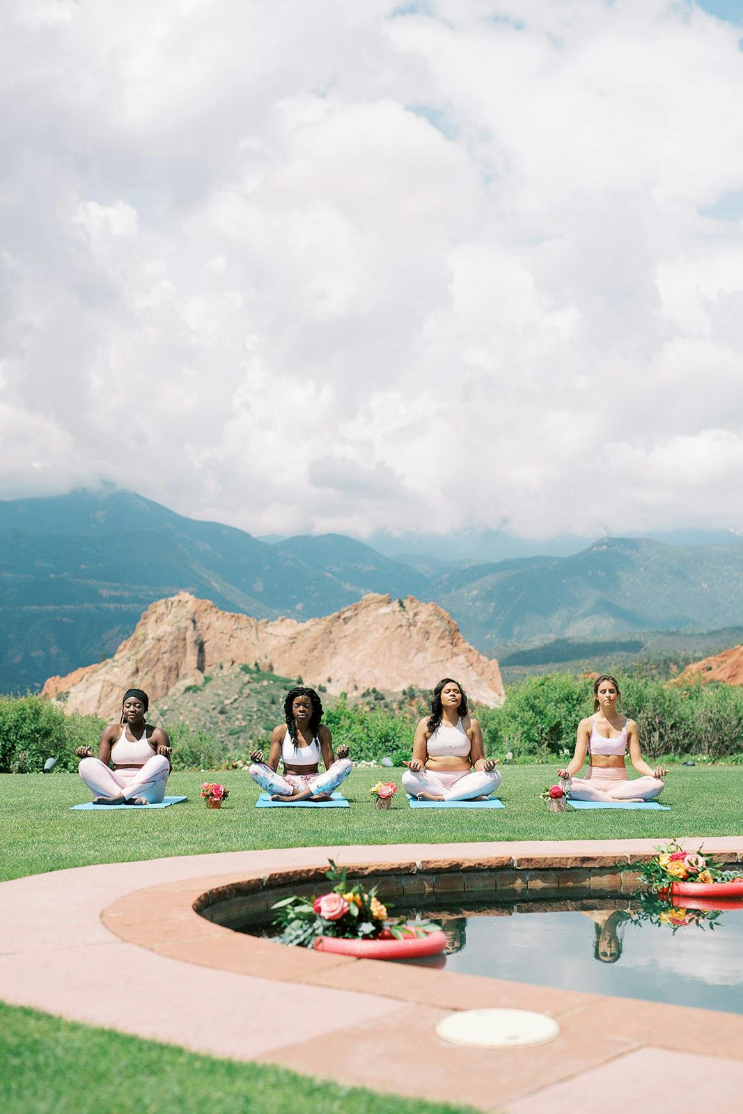 Four friends do poolside yoga at bachelorette party in Denver, CO | Partyslate