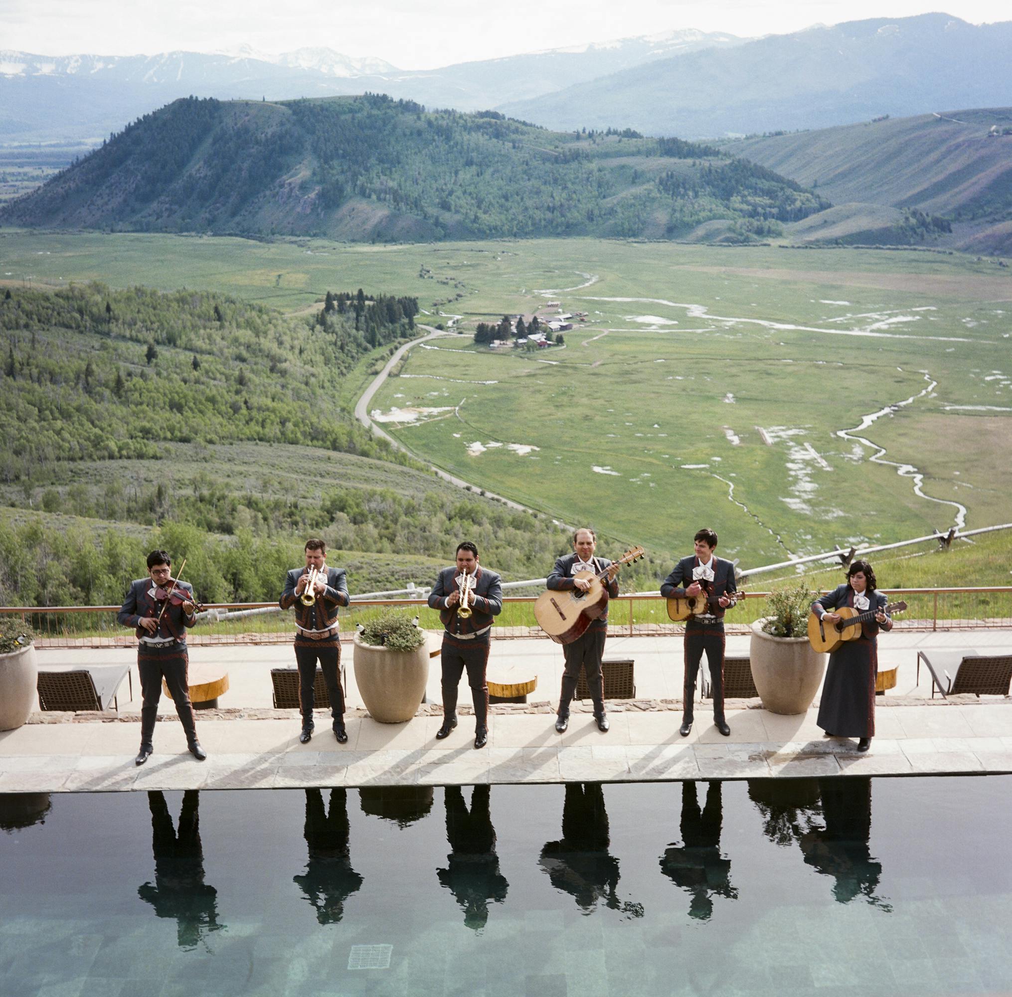 Band playing in front of scenic mountain view l PartySlate