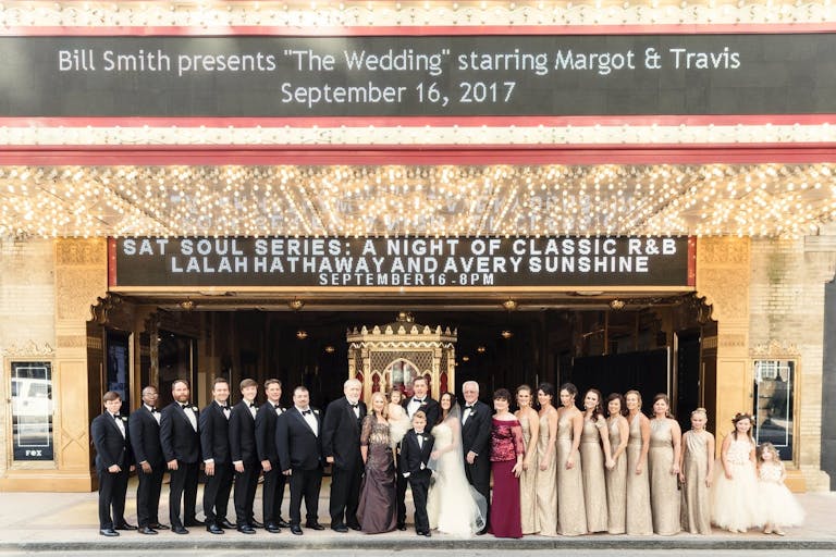 Wedding Party Stand in Front of The Fox Theatre with Personalized Marquee Signage in Atlanta, GA | PartySlate