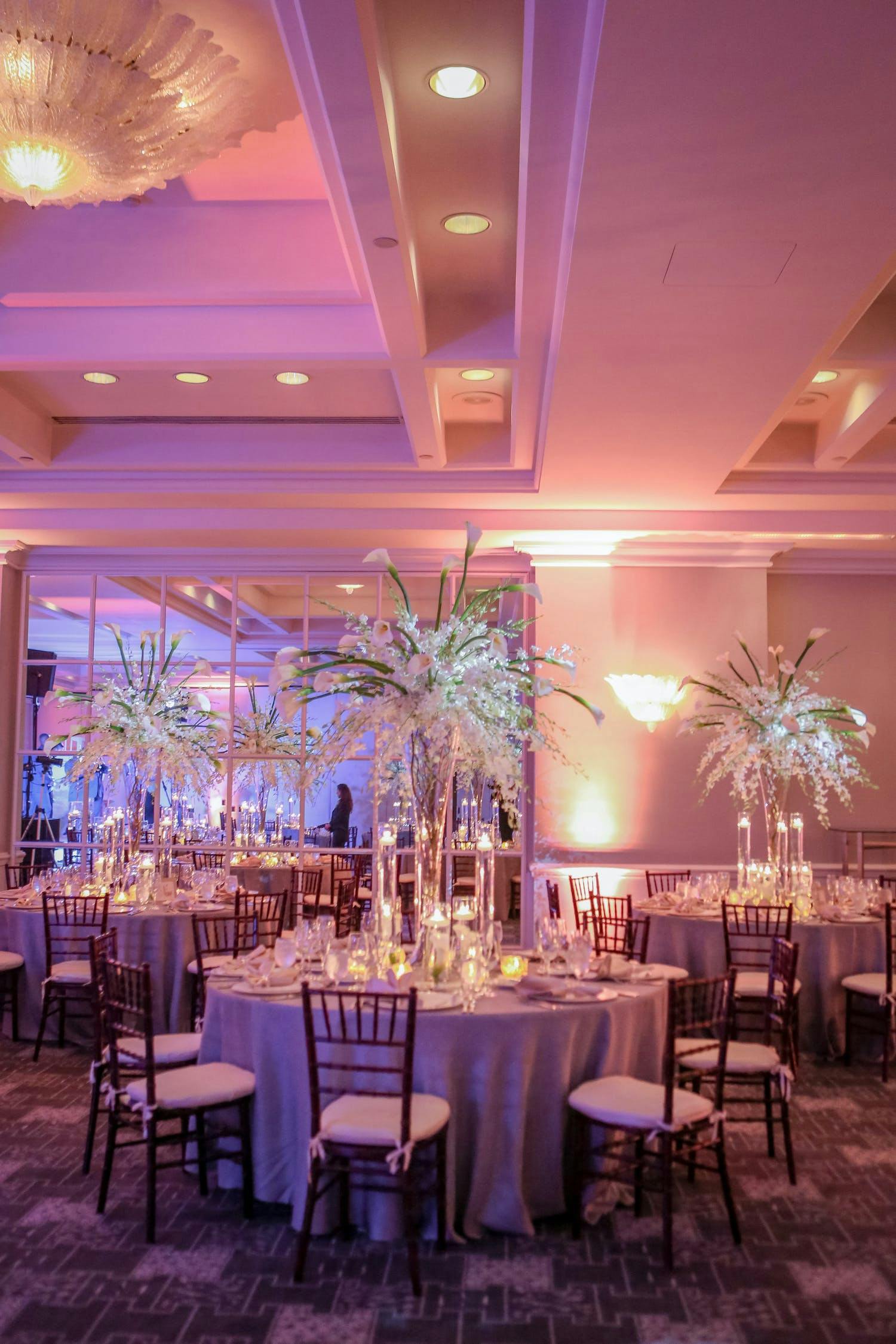 Pink uplit ballroom wedding planned by Signature Events by Abby | PartySlate