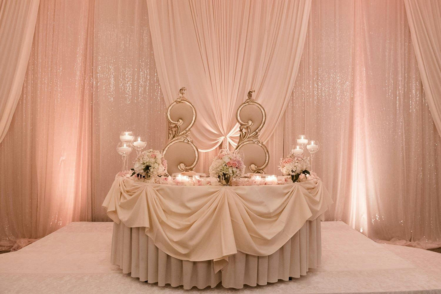 Pink and Gold Sweet Heart Table with Pink, Shimmery Backdrop at 60th-Anniversary Party | PartySlate