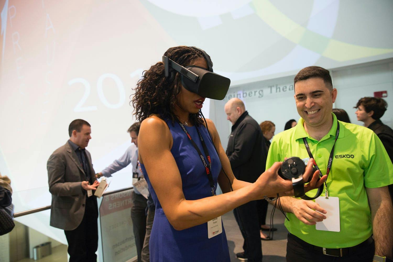 Guest tries on virtual reality headset at TEDxChicago 2019 | PartySlate