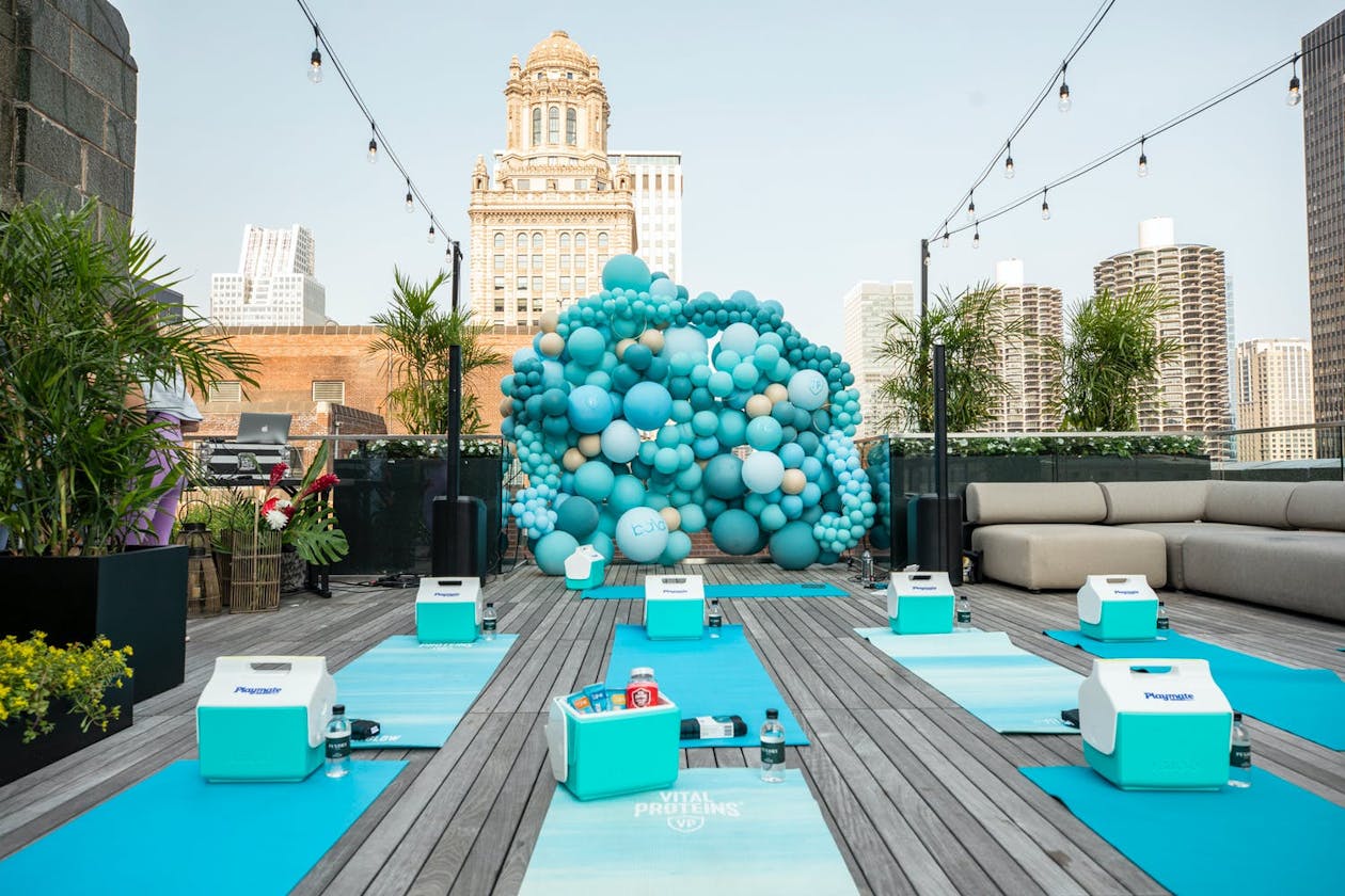 Corporate event with rooftop yoga session and blue décor | PartySlate