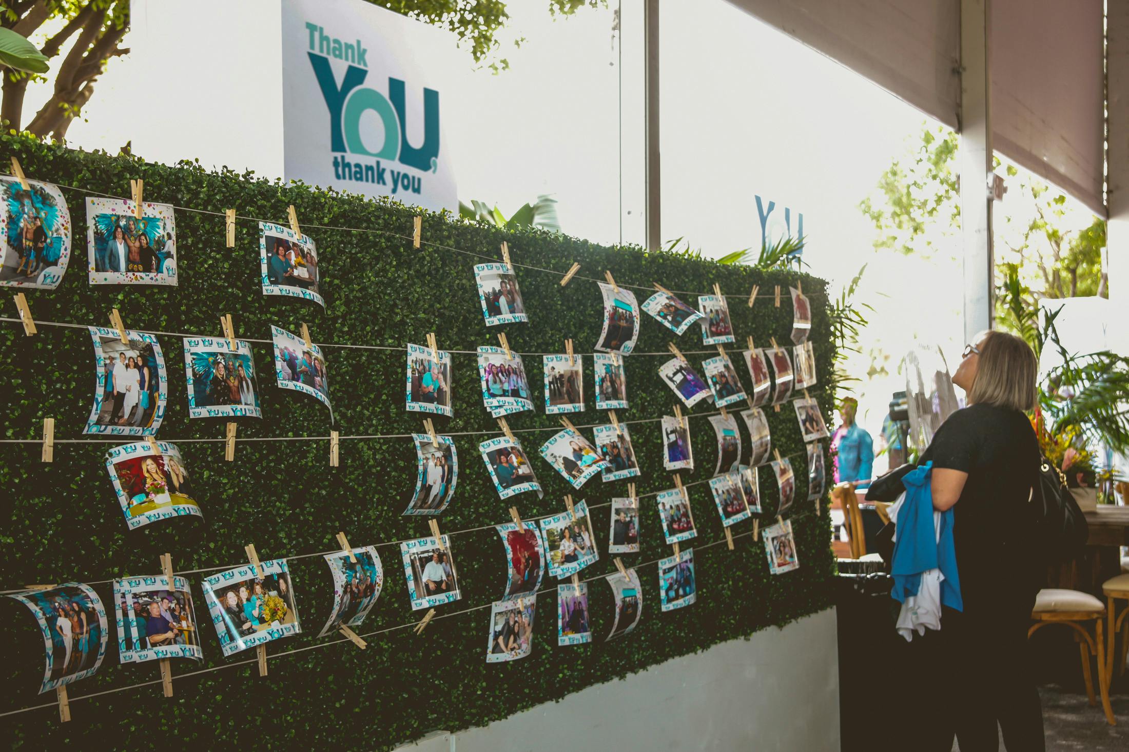 Find your photo wall covered in greenery at corporate event | PartySlate
