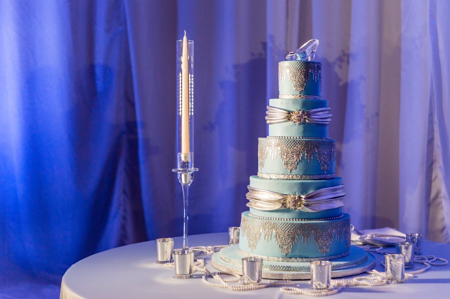Towering blue and silver Cinderella-themed quinceañera cake | PartySlate