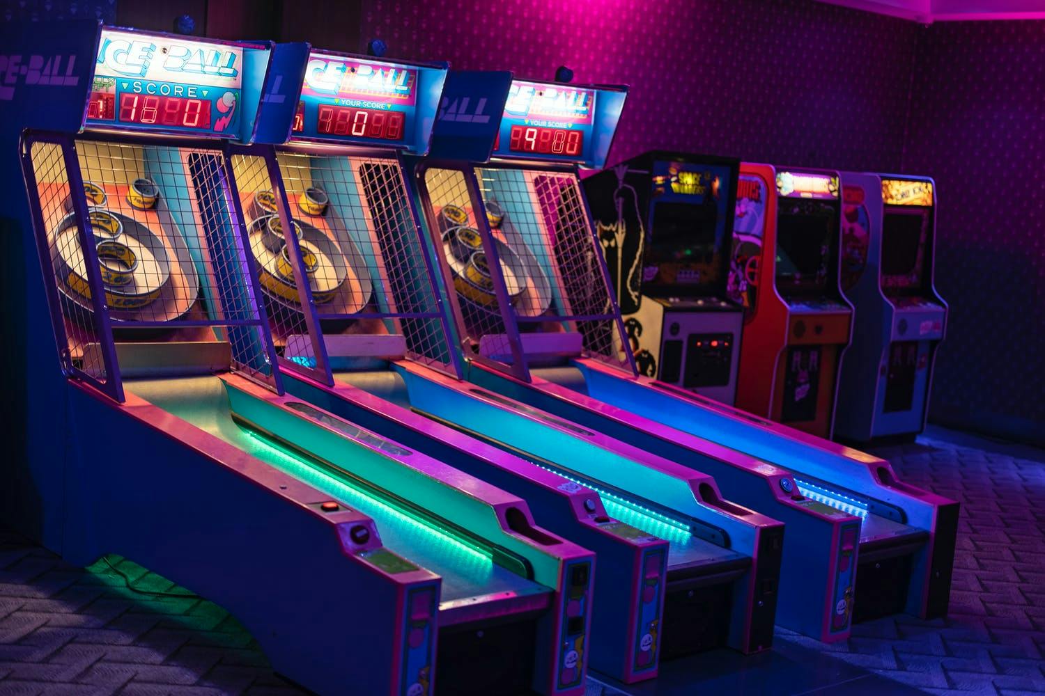 Neon skee ball arcade games at throwback 80s-themed corporate event | PartySlate
