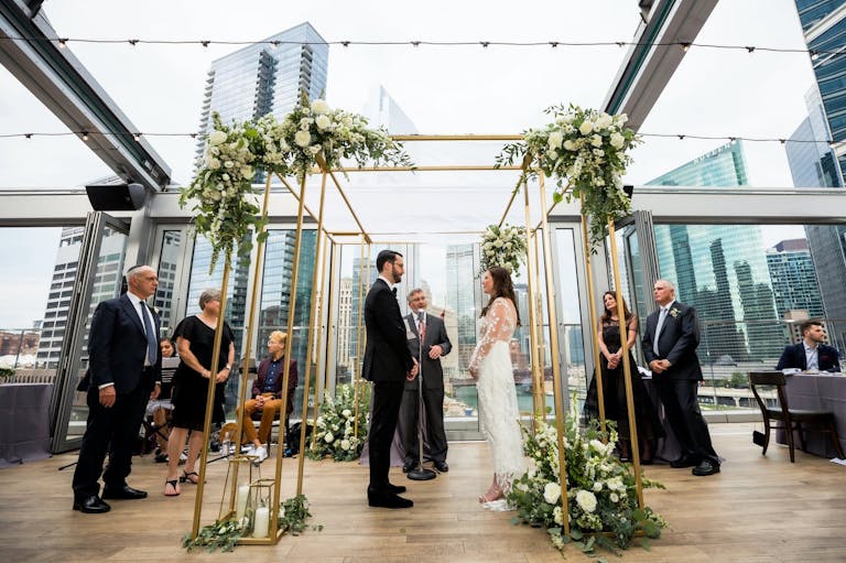 Micro wedding ceremony at Gibsons Italia with Spectacular City Views | PartySlate