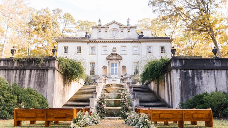 Wedding Flowers Cover Fountain at The Swan House Gardens in Atlanta, GA | PartySlate