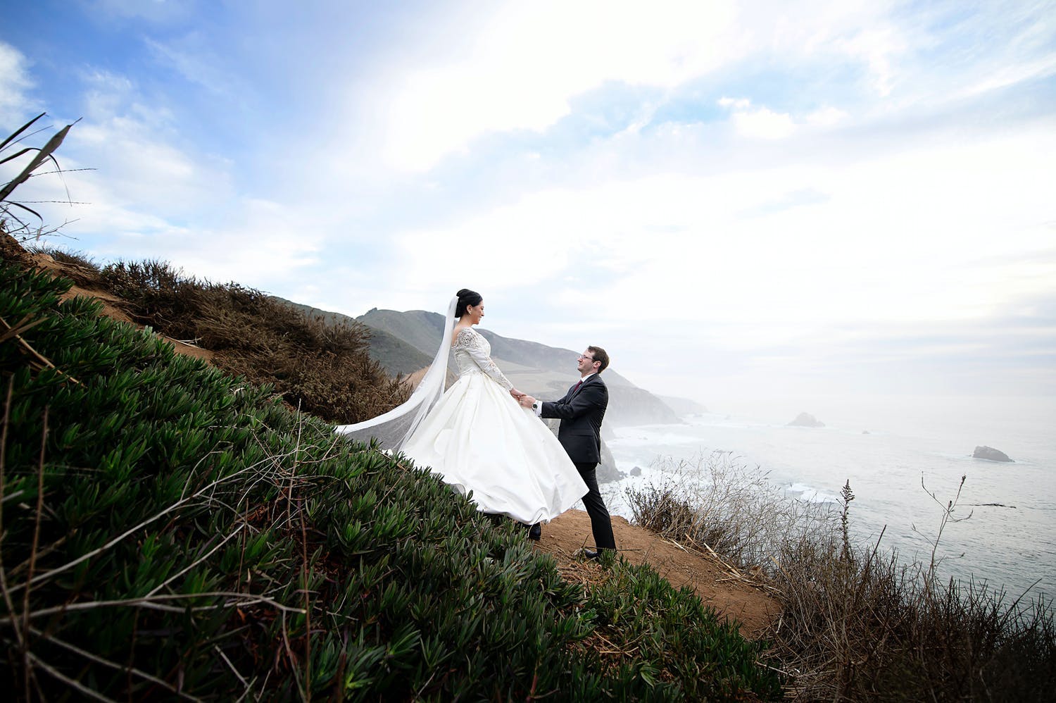 Couple poses on 17-Mile Drive including Pebble Beach between their micro wedding ceremony and private reception dinner | PartySlate