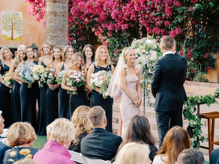 Romantic Summer Wedding with Couple at the Alter in Blush Pink Dress and Black Tux | PartySlate