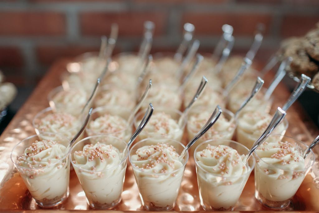White dessert with pearl toppings in individual cups for wedding | PartySlate