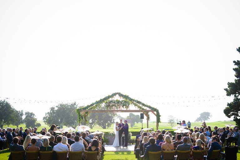 Couple Getting Married on The Golf Course at Torrey Pines | PartySlate
