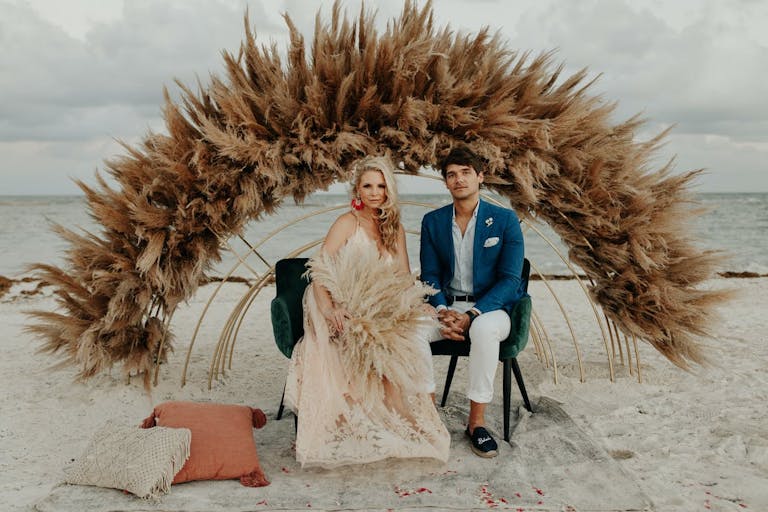 Neutral Tone Beach Destination Wedding with Pampas Grass at The Alter | PartySlate