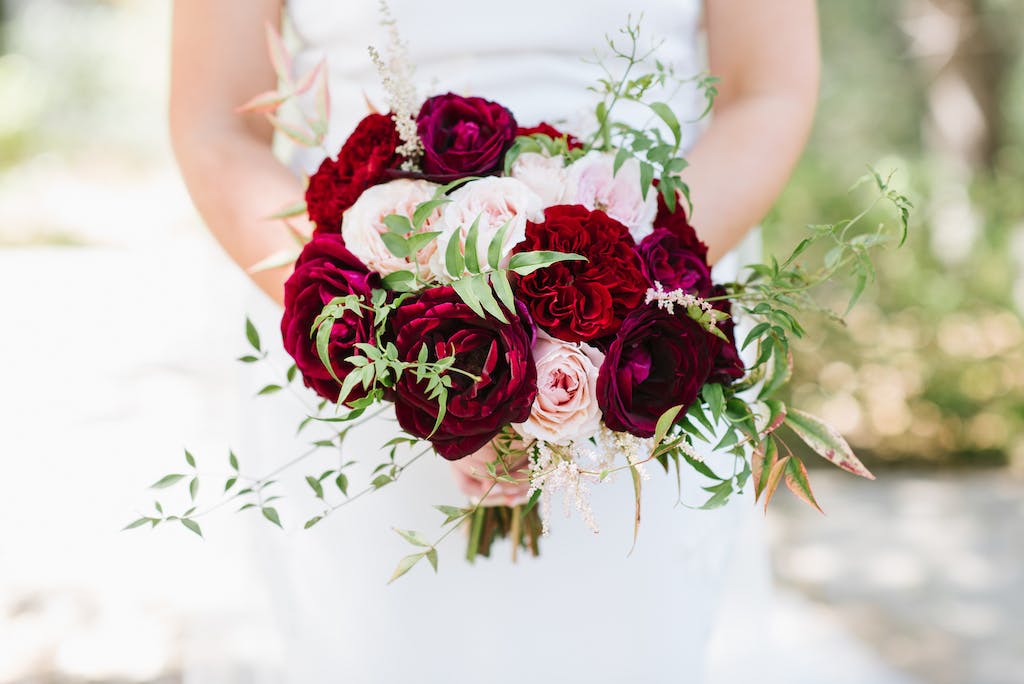 pink and red rose fall wedding bouquet | PartySlate