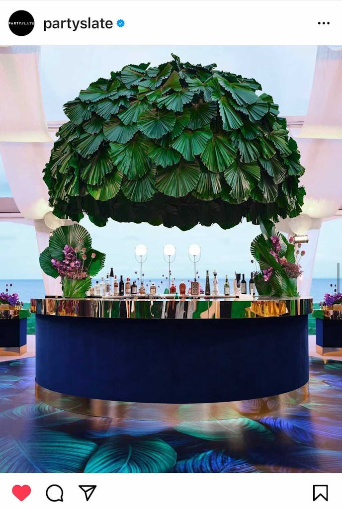 A tropical outdoor Bat Mitzvah party with a chic tent design and tropical bar set up | PartySlate