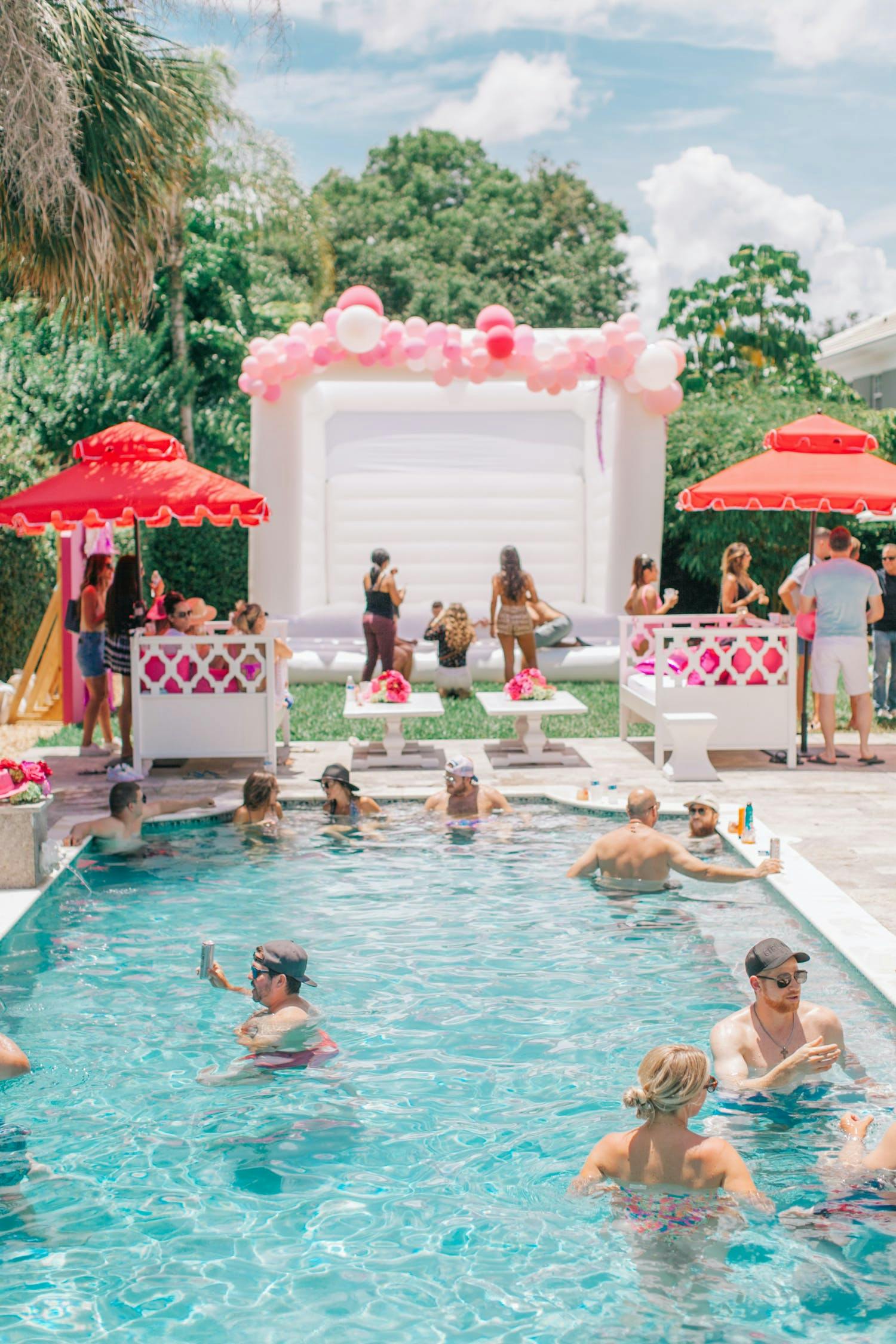 Dollywood Inspired Themed Birthday Party With White Bouncy House and Pink and Red Décor | PartySlate
