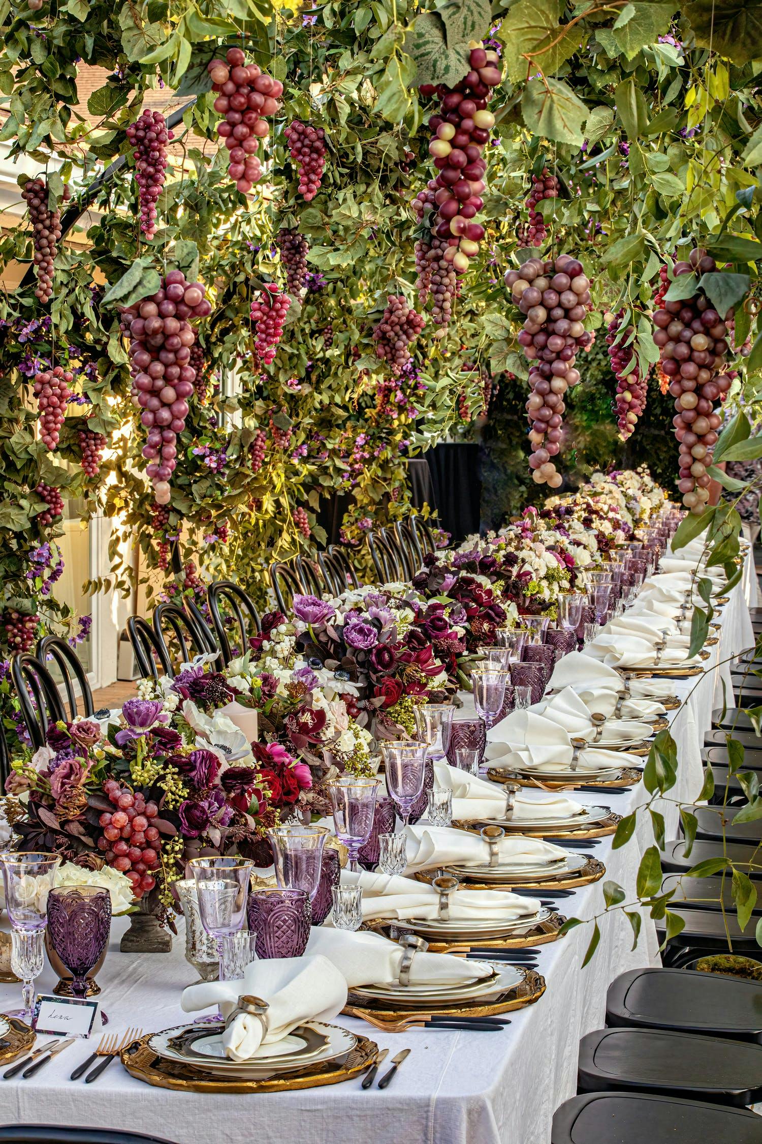 Italian Inspired Celebration Tablescape with Grapes and Vines | PartySlate