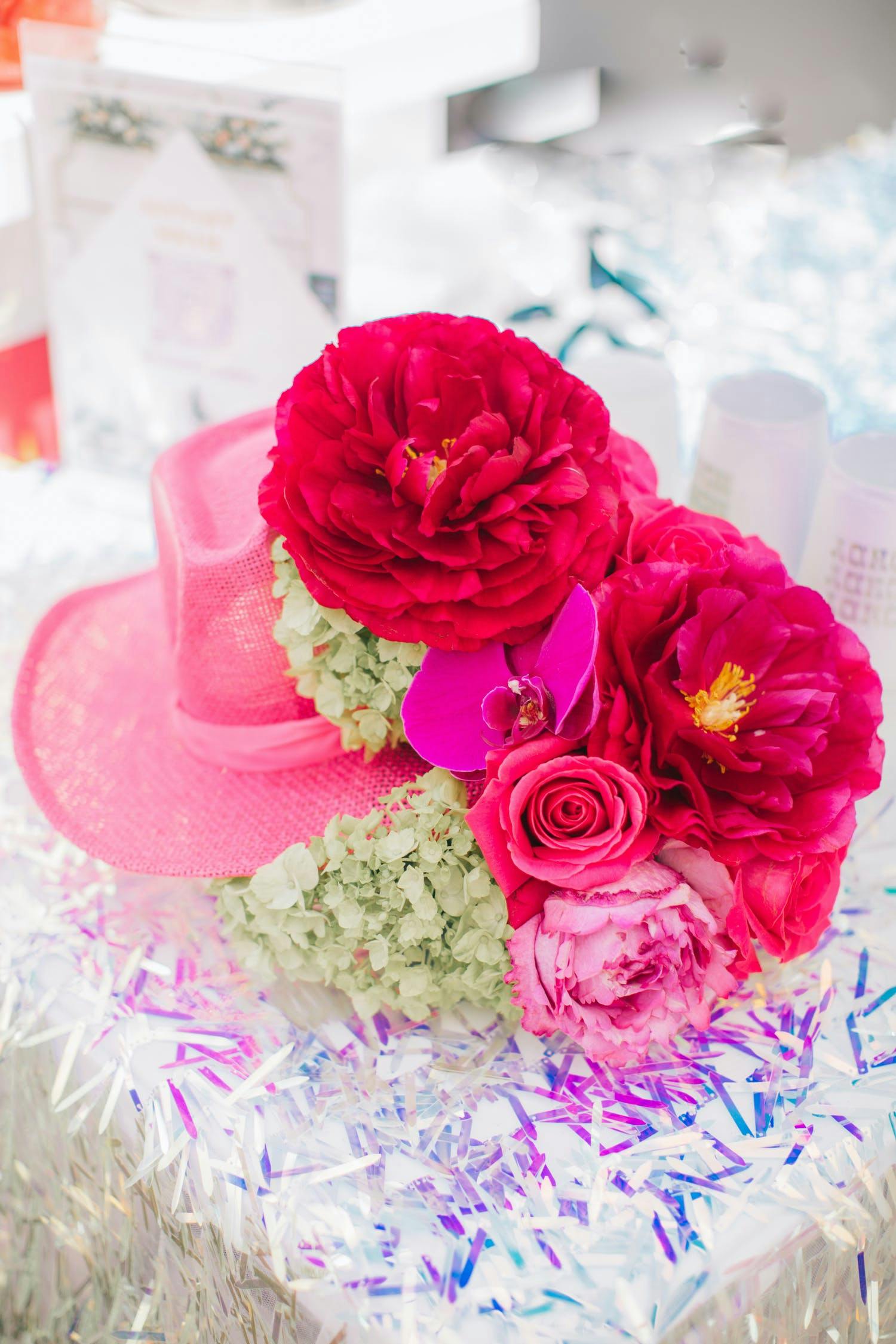 Dollywood Inspired Themed Birthday Party with Pink and Red Florals and Pink Cowboy Hats | PartySlate