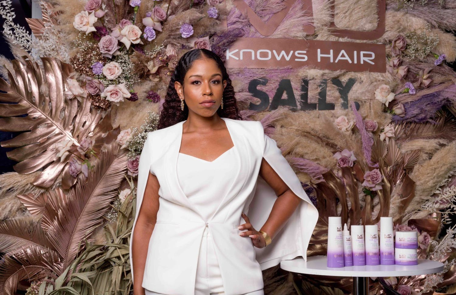 Purple and rose gold-themed product launch for Natural hair influencer and licensed stylist Monica Stevens | PartySlate