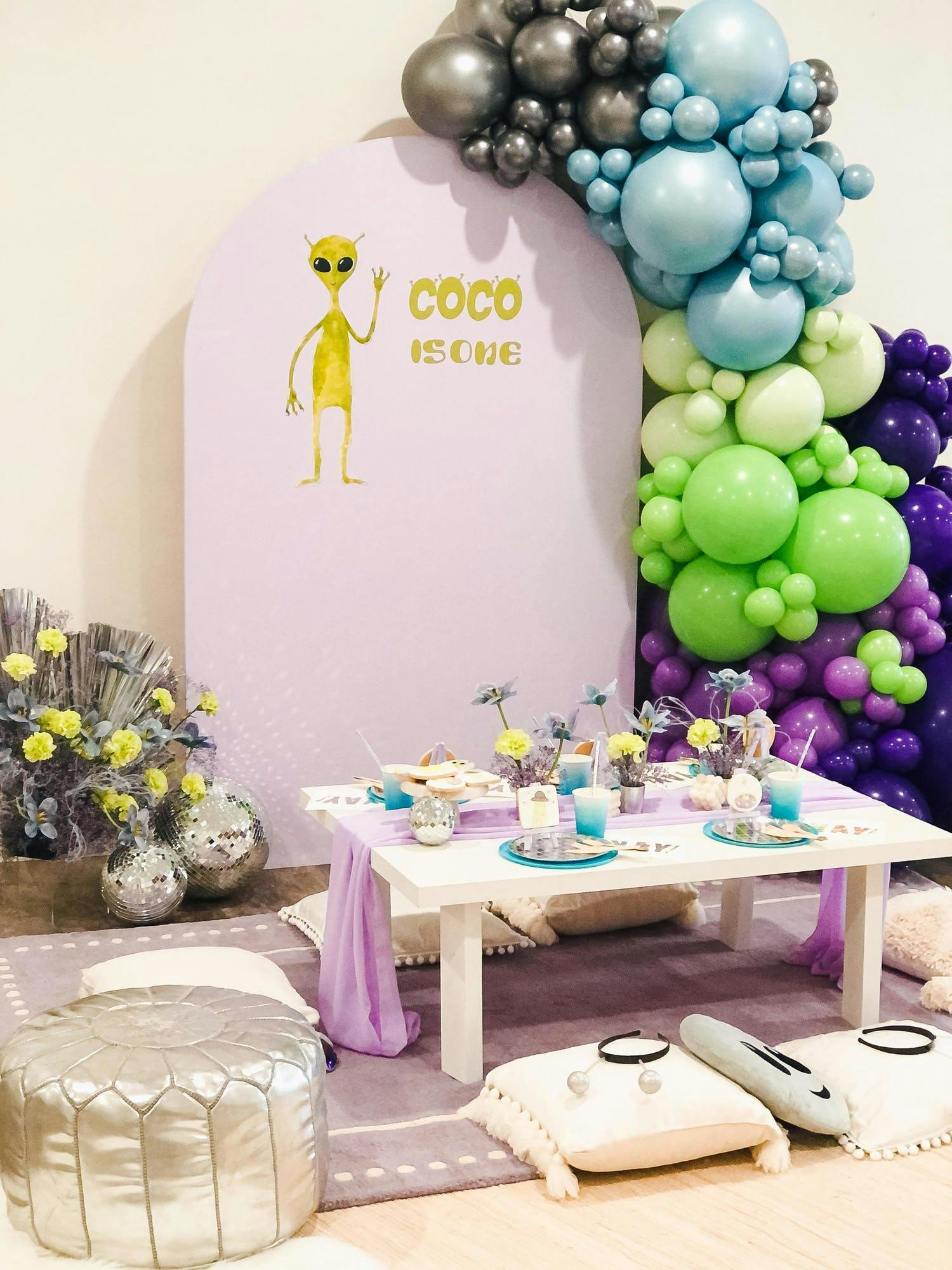 Extraterrestrial Party Theme with Blue and Purple Balloons and Backdrop | PartySlate