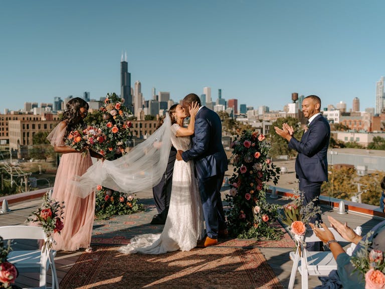 Eclectic Intimate Rooftop Wedding at The Hoxton Chicago with the Chicago Skyline in the Background | PartySlate