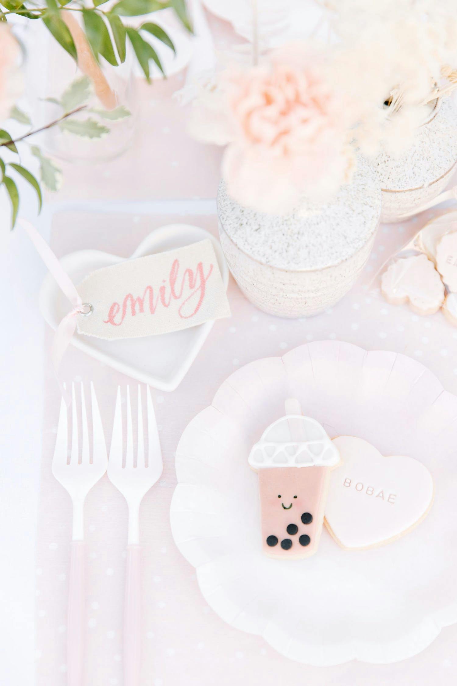 Boba Tea Themed Celebration With Pastel Pink and White Décor and Smily Faced Boba Tea Desserts | PartySlate