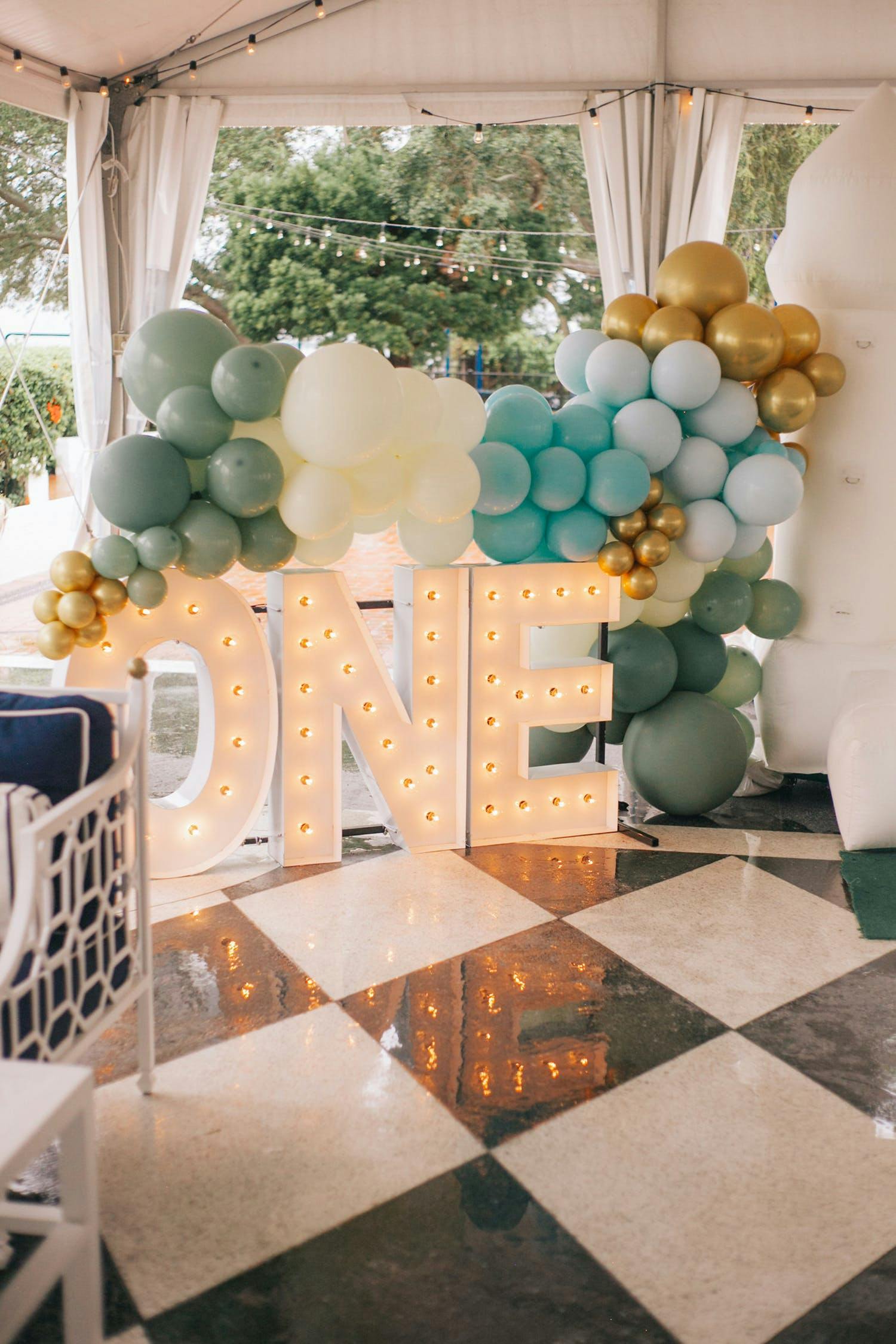 Golf Inspired First Birthday Party with Marquee Letters and Neutral Tone Balloons | PartySlate