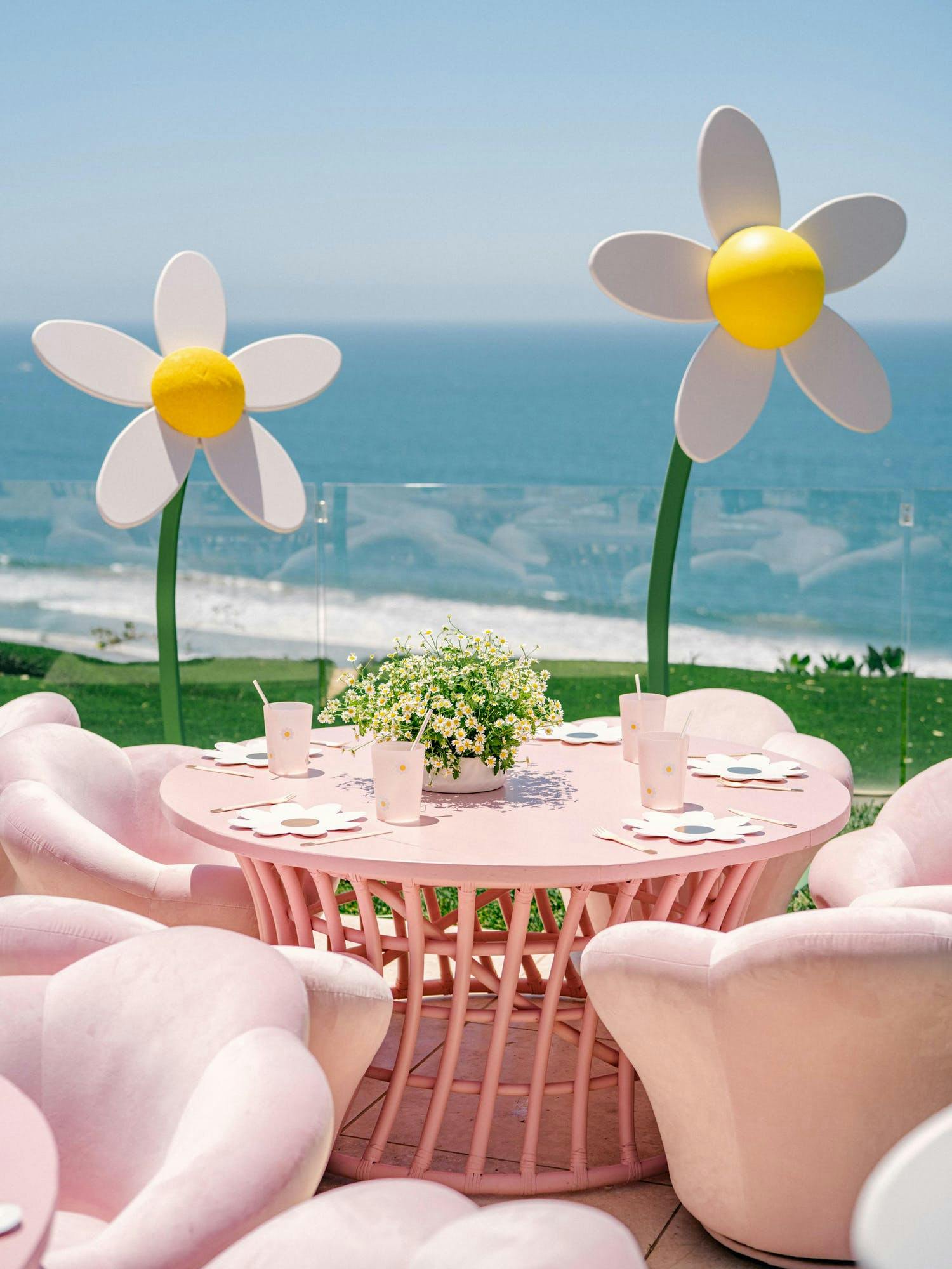Daisy Themed Birthday Party With Pink Tables and Seating and Daisy Décor | PartySlate