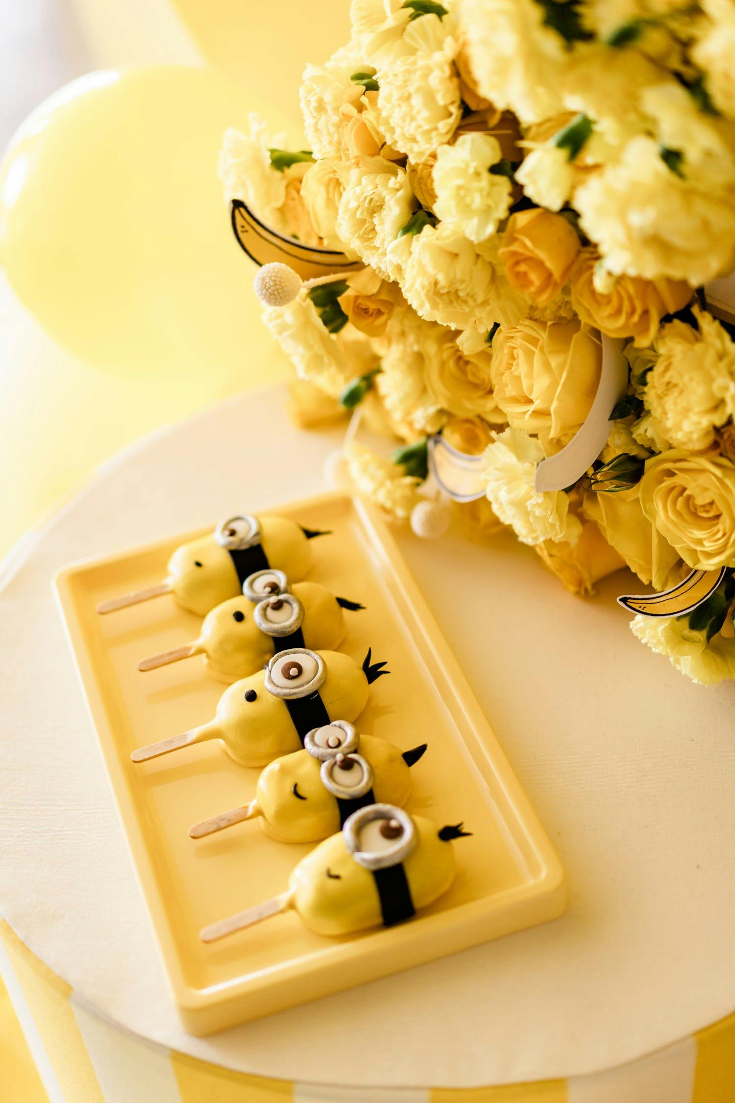 Despicable Me Minions Themes Party With Minions Cake Pops and Yellow Florals | PartySlate