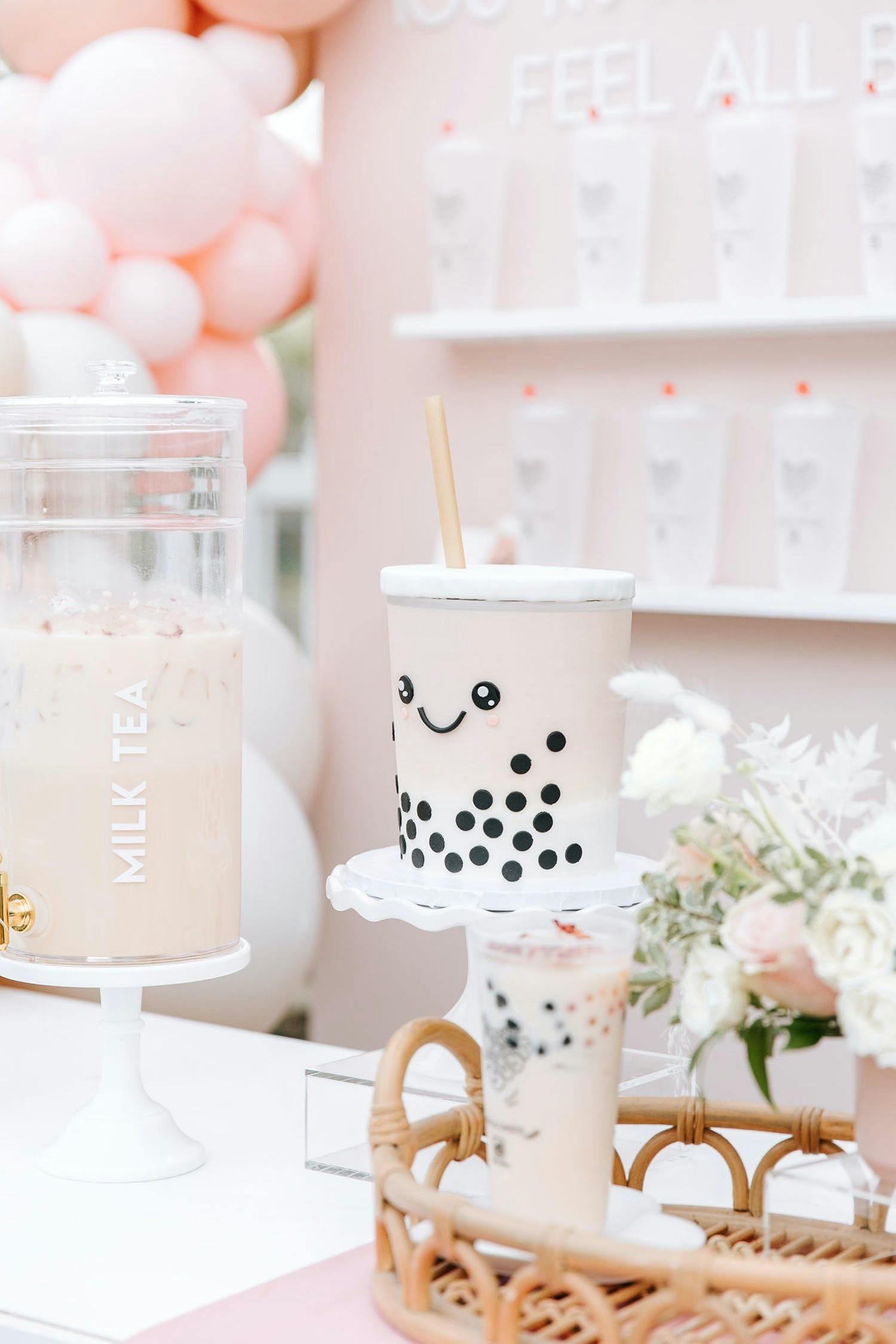 Boba Tea Themed Celebration With Pastel Pink and White Décor and Smily Faced Boba Tea Desserts | PartySlate