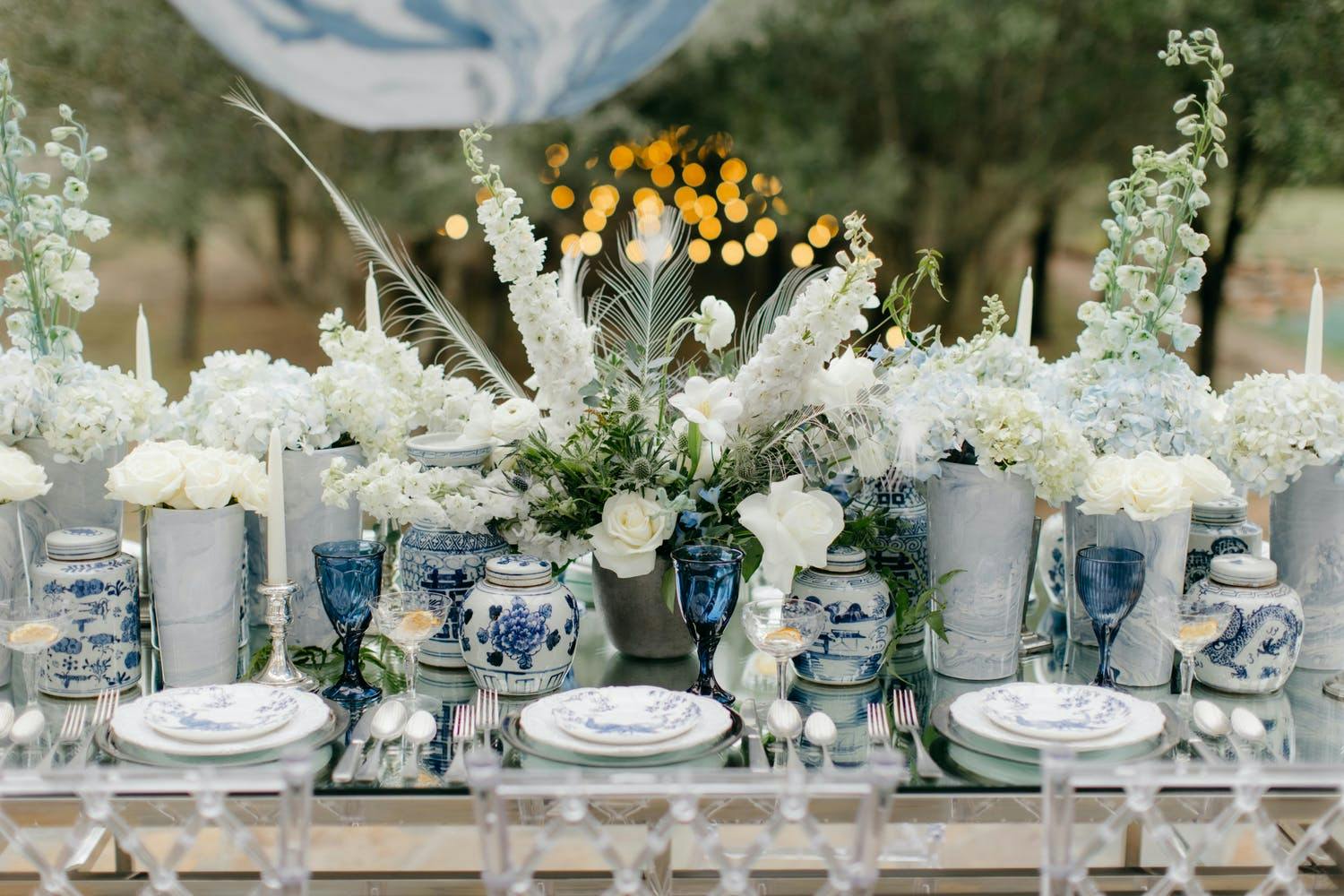 White floral and chinoiserie winter wedding centerpieces | PartySlate