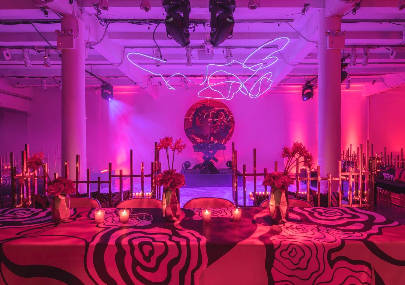 Industrial wedding with rose linen, abstract neon lighting, and purple uplighting | PartySlate
