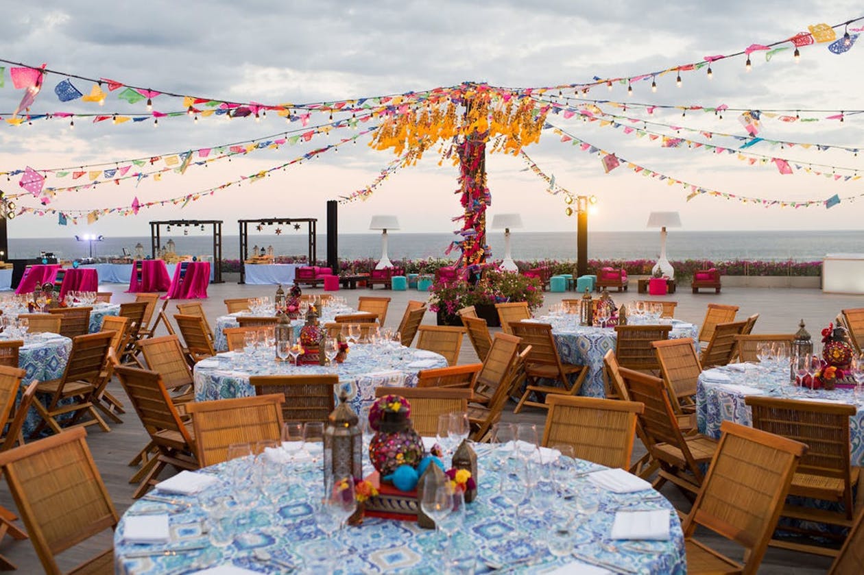Oceanside Sangeet with colorful floral décor | PartySlate