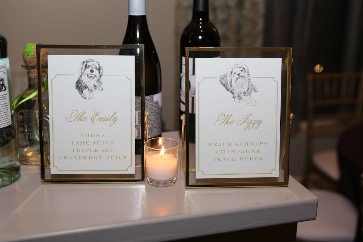 two wedding cocktail menus with drawings of dogs | PartySlate