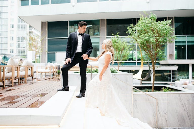 Couple Walking Up Stairs On Unique Dallas Outdoor Rooftop | PartySlate